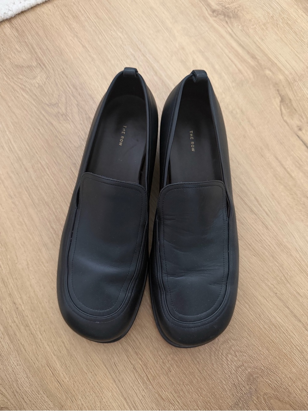 The Row Flynn Black Leather Slip-On Loafers